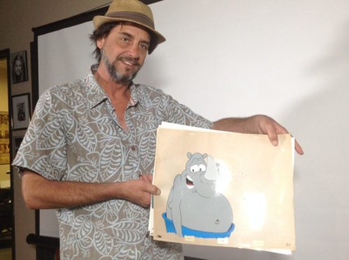 Bill Kopp, animator, writer and voice actor, displays an animation cell