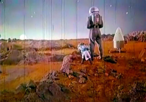 Dog and hooman on the Martian surface, from Pavel Klushantsev's Mars (1968)