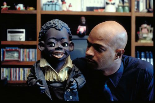 Damon Wayans examines a racist collectible in Bamboozled (2000)